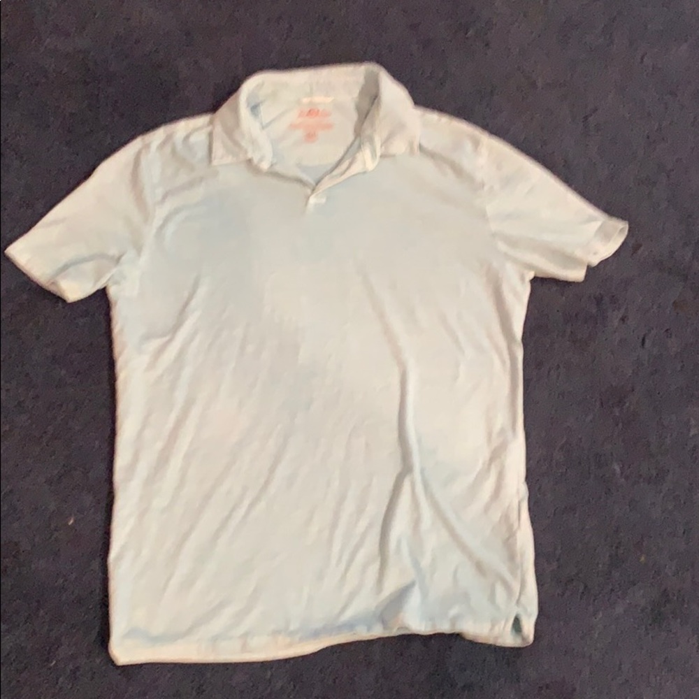 Light blue polo shirt.